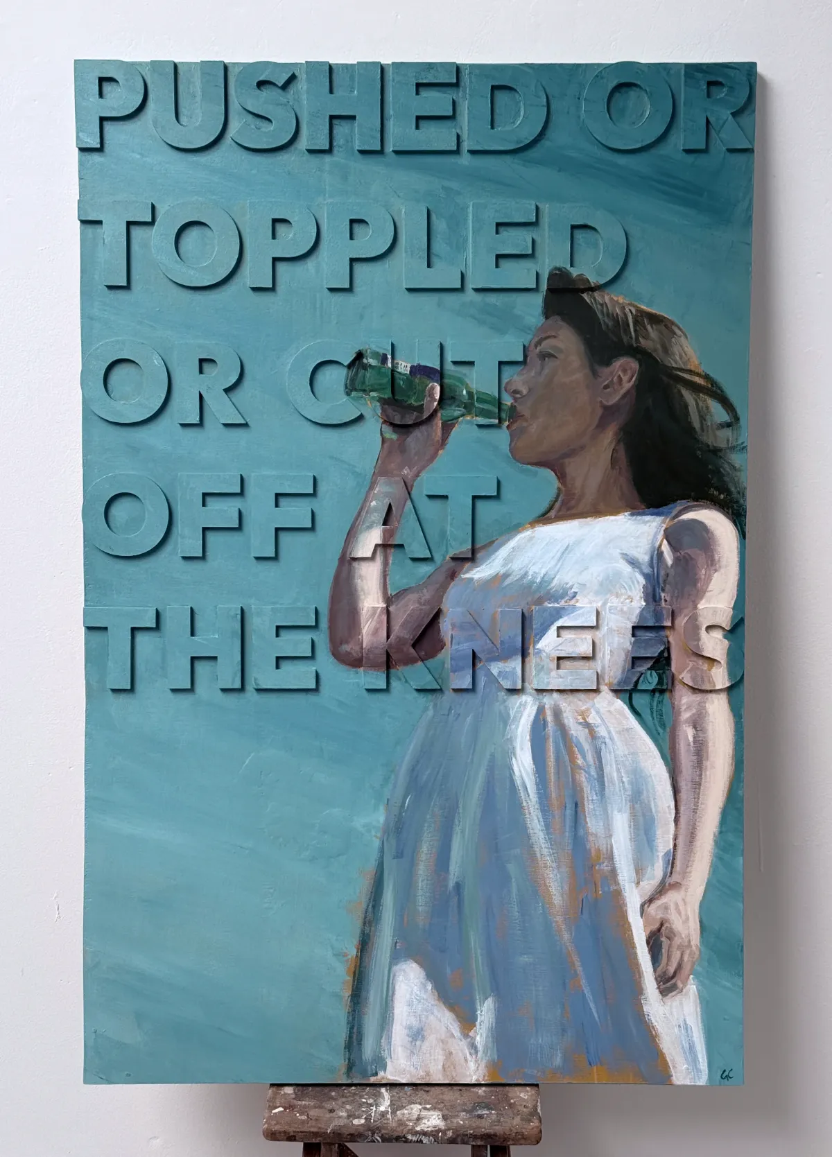 A photo of a painting on a raised relief panel with letters of a young woman swigging a beer on a sunny day
